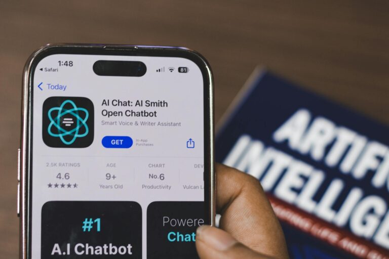 Webpage of Ai Chatbot, a prototype AI Smith Open chatbot, is seen on the website of OpenAI, on a apple smartphone. Examples, capabilities, and limitations are shown.